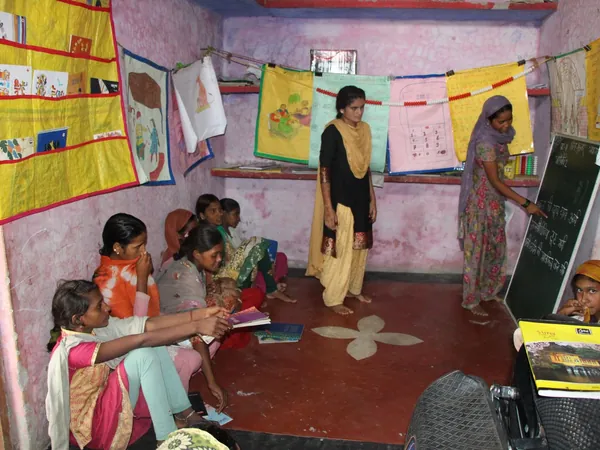Girls learning together in a bright, colorful classroom